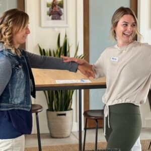 Two Women Smiling Practicing Muscle Testing