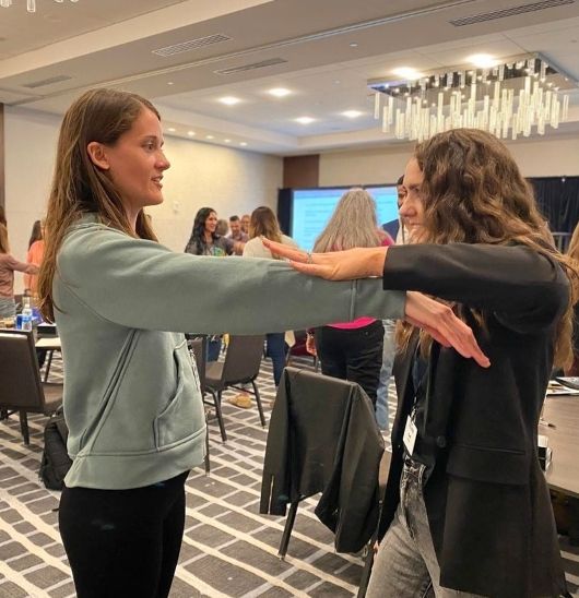 two students practicing muscle testing